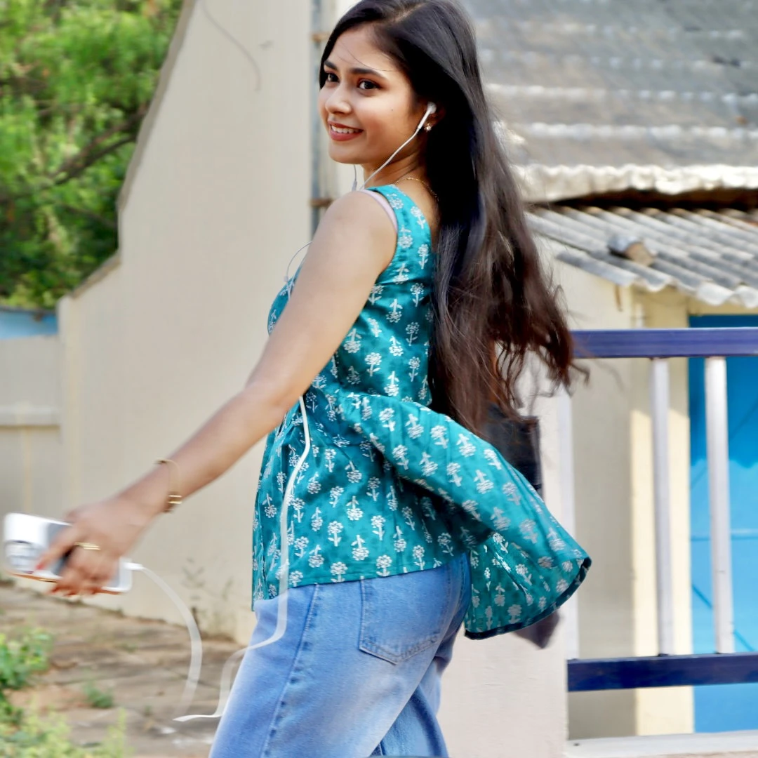 Green Sleeveless Peplum Top
